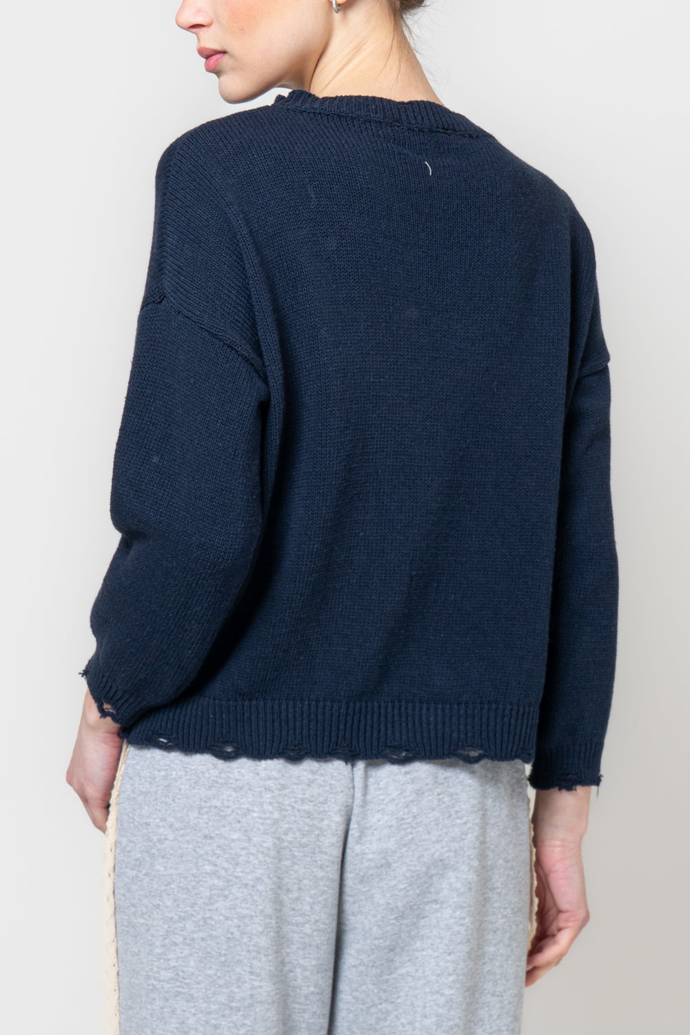 Maglia con profili sdruciti