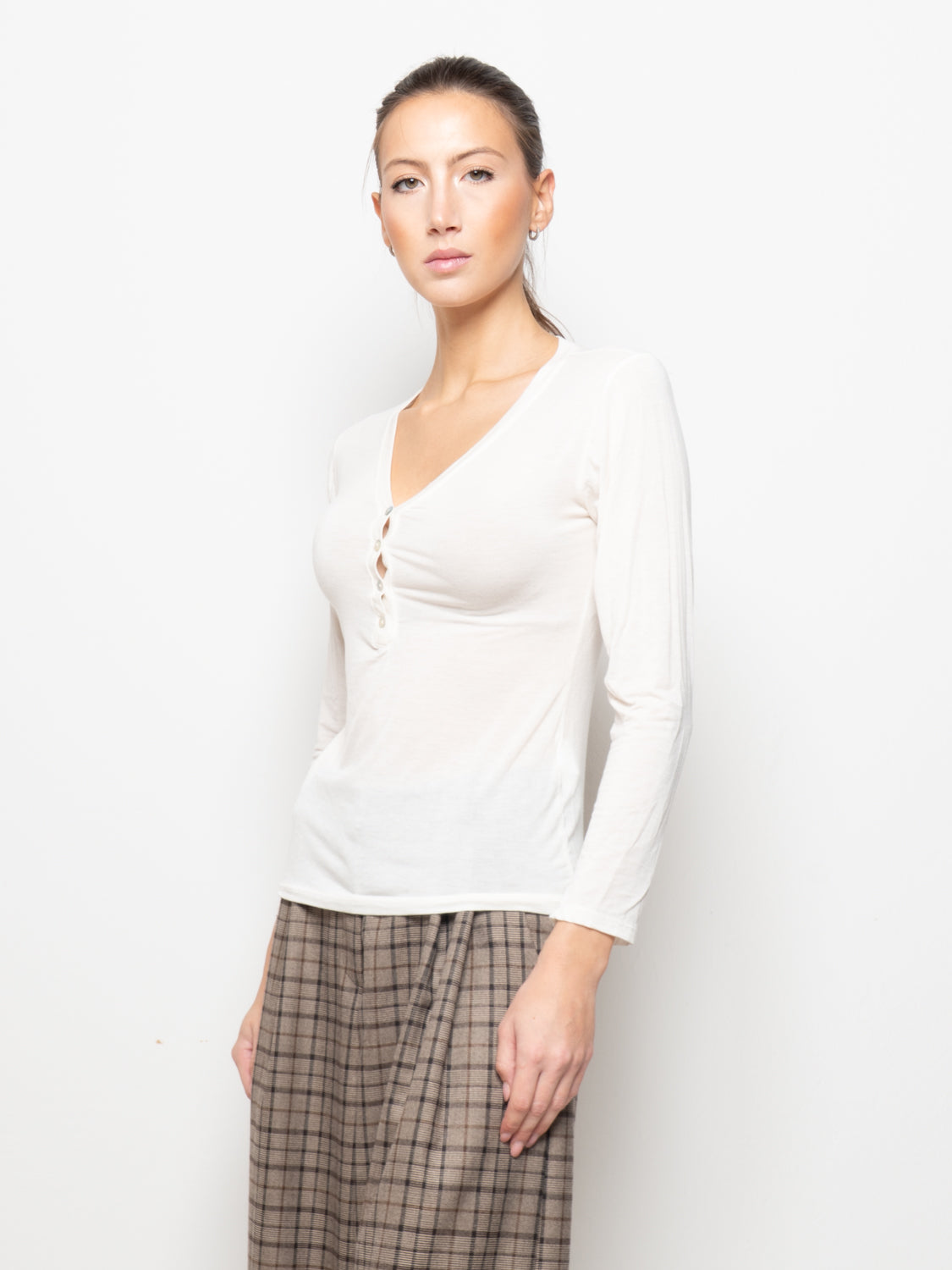 Top con scollo a V sul retro e bottoncini
