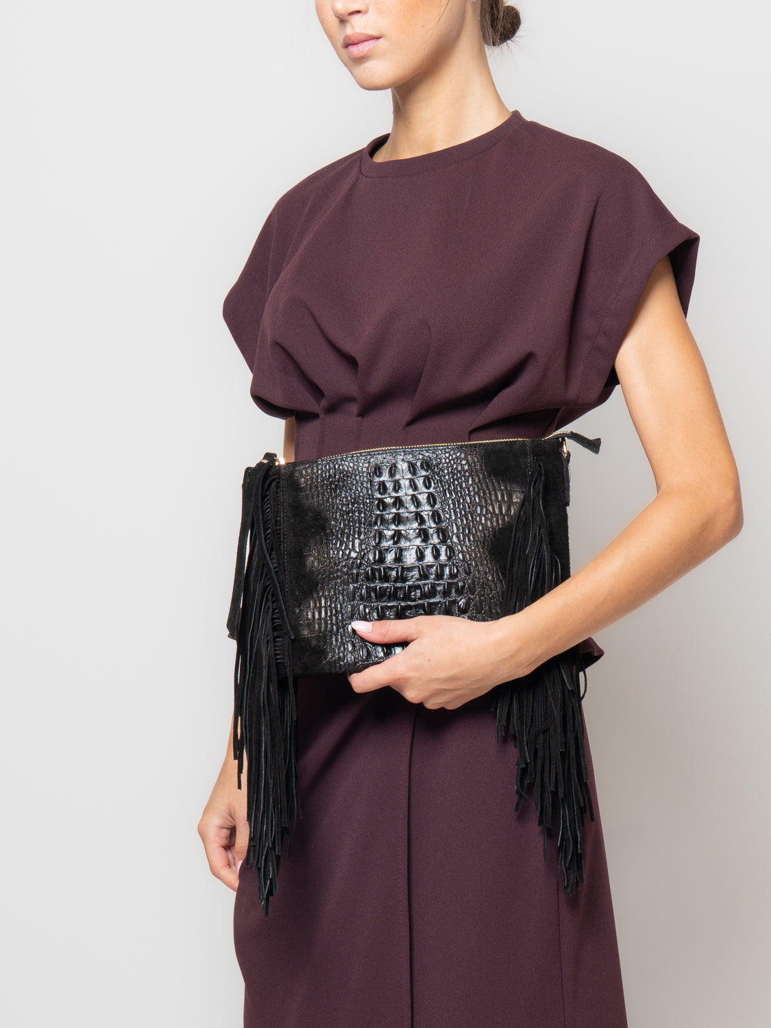 Pochette in pelle effetto coccodrillo con frange